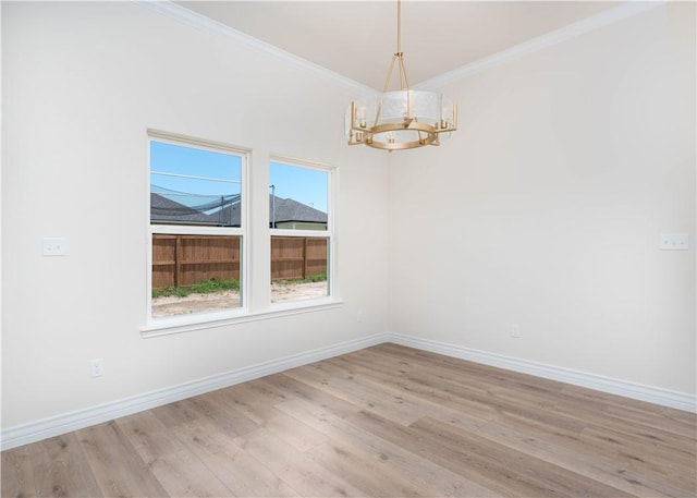 3618 Perry, Corpus Christi, TX 78410 - empty room with a chandelier, ornamental molding, light wood-type flooring, and baseboards