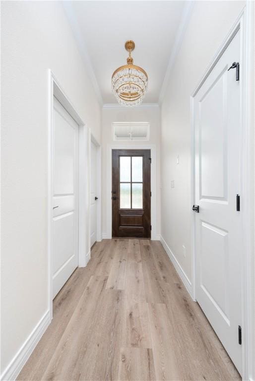 3618 Perry, Corpus Christi, TX 78410 - entryway featuring ornamental molding, a chandelier, light wood-type flooring, and baseboards
