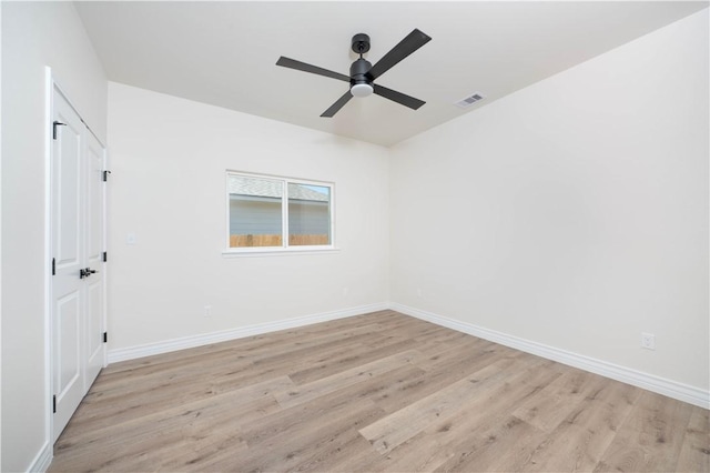 3618 Perry, Corpus Christi, TX 78410 - spare room featuring light wood-type flooring, a ceiling fan, and baseboards