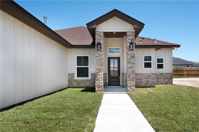 3618 Perry, Corpus Christi, TX 78410 - doorway to property with roof with shingles and board and batten siding