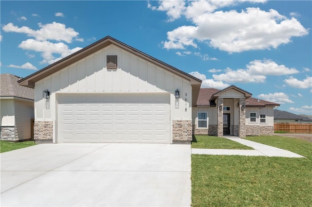 3618 Perry, Corpus Christi, TX 78410 - view of front facade with stone siding, board and batten siding, and driveway