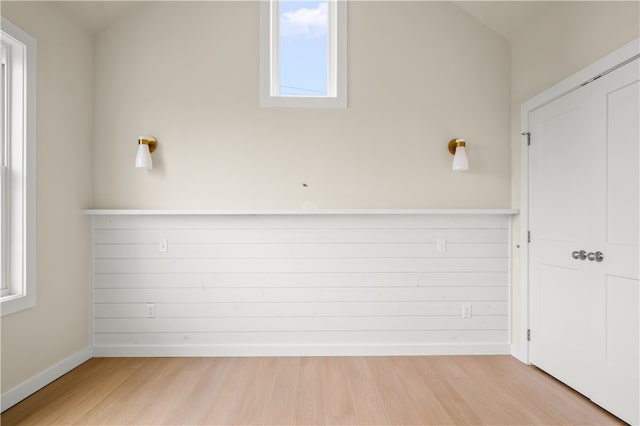 empty room featuring light hardwood / wood-style flooring and plenty of natural light