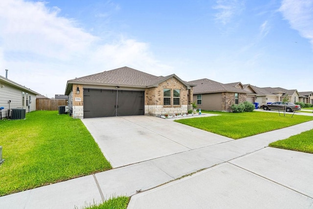 7753 Lariat Toss Dr, Corpus Christi, TX 78414 - ranch-style home with a garage, driveway, central AC unit, and stone siding