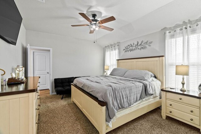 7753 Lariat Toss Dr, Corpus Christi, TX 78414 - bedroom featuring dark colored carpet, lofted ceiling, and ceiling fan