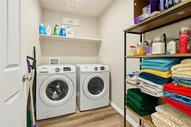 7753 Lariat Toss Dr, Corpus Christi, TX 78414 - washroom with washing machine and clothes dryer, wood finished floors, and baseboards