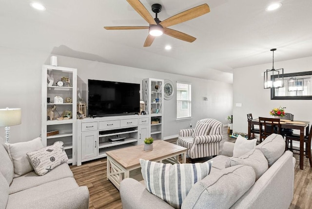 7753 Lariat Toss Dr, Corpus Christi, TX 78414 - living area with a chandelier, wood finished floors, a ceiling fan, and recessed lighting
