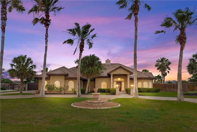 5514 King Trl, Corpus Christi, TX 78414 - mediterranean / spanish home with stucco siding, a tiled roof, and a chimney