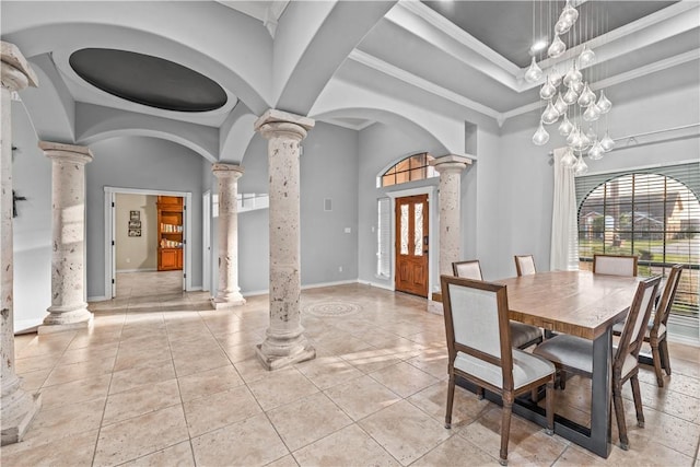 5514 King Trl, Corpus Christi, TX 78414 - dining room with decorative columns, a raised ceiling, plenty of natural light, baseboards, and a towering ceiling