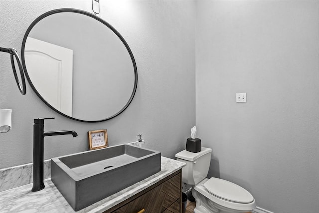 5514 King Trl, Corpus Christi, TX 78414 - bathroom featuring toilet, vanity, and baseboards