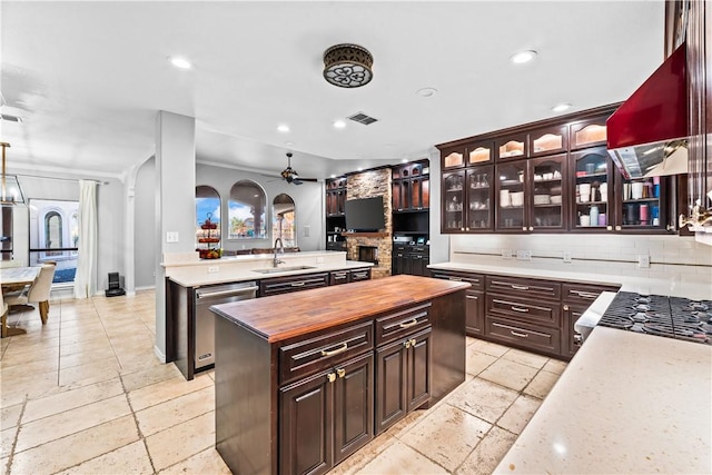 5514 King Trl, Corpus Christi, TX 78414 - kitchen with a sink, butcher block countertops, a kitchen island, stainless steel dishwasher, and exhaust hood