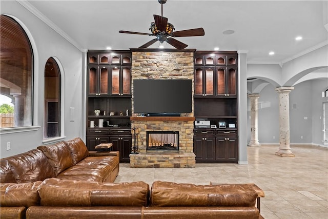 5514 King Trl, Corpus Christi, TX 78414 - living room with decorative columns, arched walkways, ceiling fan, light tile patterned floors, and ornamental molding