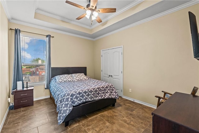 5514 King Trl, Corpus Christi, TX 78414 - bedroom with a tray ceiling, ornamental molding, baseboards, and a ceiling fan