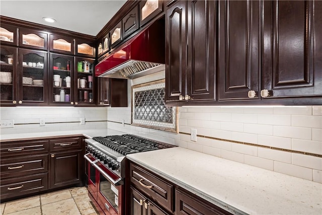 5514 King Trl, Corpus Christi, TX 78414 - kitchen featuring range with two ovens, light countertops, decorative backsplash, and glass insert cabinets