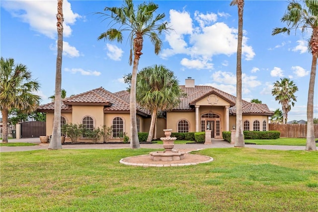 5514 King Trl, Corpus Christi, TX 78414 - mediterranean / spanish-style house with stucco siding, a chimney, and a tile roof