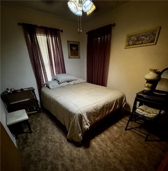 bedroom with dark colored carpet