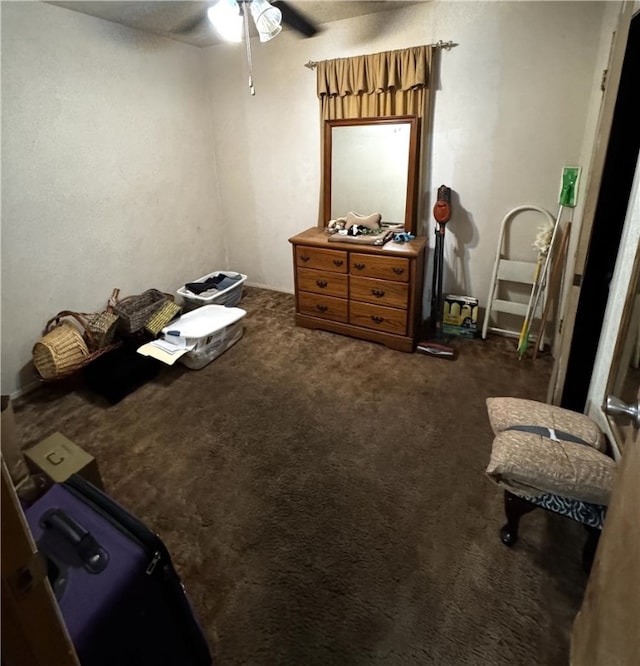 miscellaneous room featuring a ceiling fan and carpet flooring