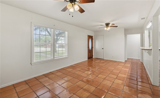 620 E 9th St, Bishop, TX 78343 - spare room with ceiling fan, baseboards, light tile patterned floors, and visible vents