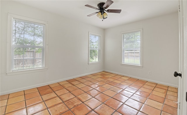 620 E 9th St, Bishop, TX 78343 - empty room featuring baseboards, a ceiling fan, and light tile patterned floors