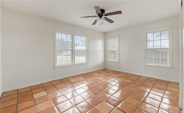 620 E 9th St, Bishop, TX 78343 - unfurnished room with a ceiling fan, baseboards, light tile patterned flooring, and a healthy amount of sunlight