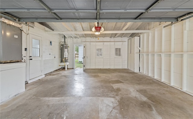 620 E 9th St, Bishop, TX 78343 - garage with a garage door opener and gas water heater