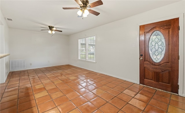 620 E 9th St, Bishop, TX 78343 - foyer featuring light tile patterned floors, visible vents, baseboards, and ceiling fan