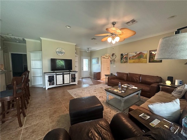 113 N Santa Clara Dr, Rockport, TX 78382 - living room with crown molding, tile patterned floors, and a ceiling fan