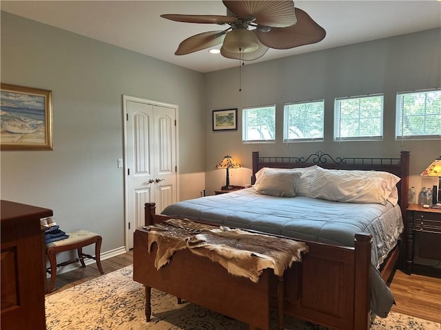 113 N Santa Clara Dr, Rockport, TX 78382 - bedroom featuring light wood-type flooring, a closet, a ceiling fan, and baseboards