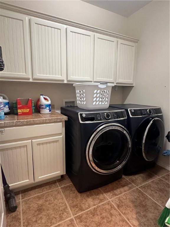 113 N Santa Clara Dr, Rockport, TX 78382 - washroom featuring cabinet space, washing machine and dryer, and light tile patterned floors