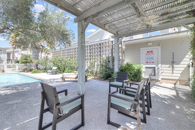 view of patio with a community pool and a pergola