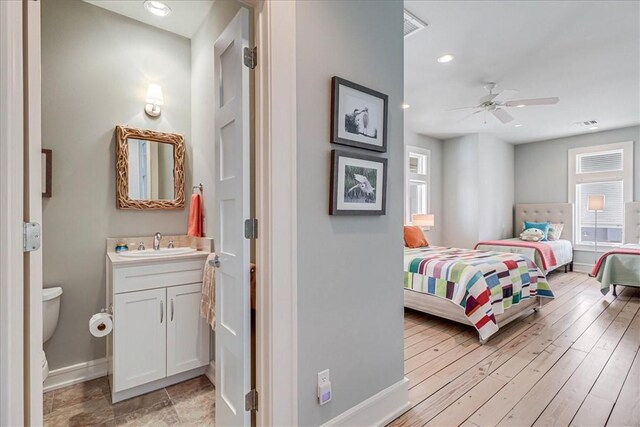 bedroom featuring ceiling fan and light hardwood / wood-style flooring