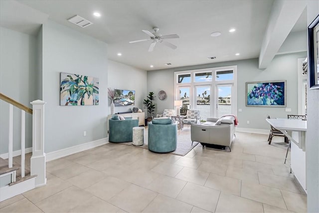 kitchen featuring sink, stainless steel appliances, white cabinets, and a center island with sink