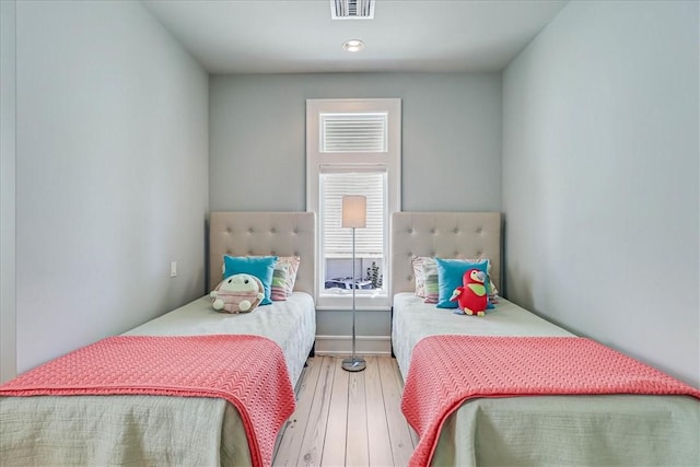 bedroom featuring ceiling fan and light wood-type flooring