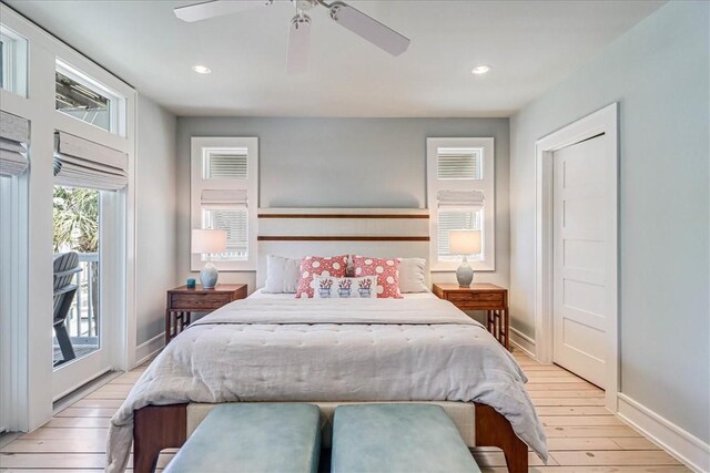 bedroom with light hardwood / wood-style flooring, access to outside, and ceiling fan