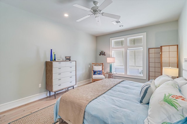 bedroom featuring hardwood / wood-style flooring and ceiling fan