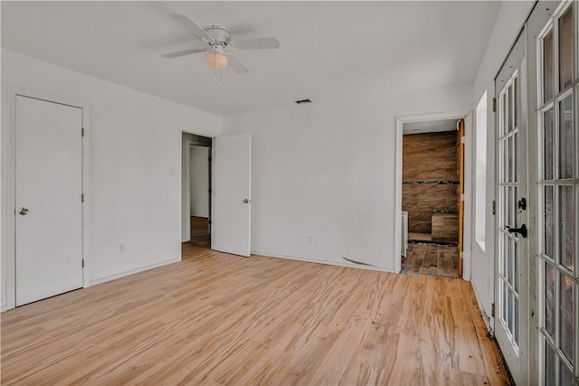 5367 Paloma Trl, Robstown, TX 78380 - unfurnished bedroom featuring wood finished floors, baseboards, connected bathroom, and ceiling fan
