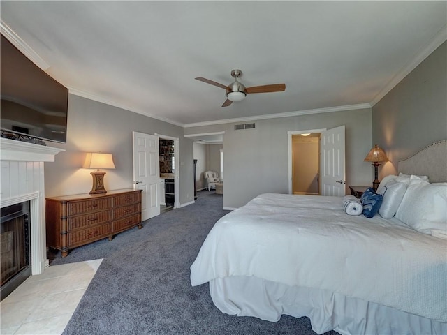 bedroom featuring ceiling fan, light carpet, a fireplace with flush hearth, visible vents, and crown molding