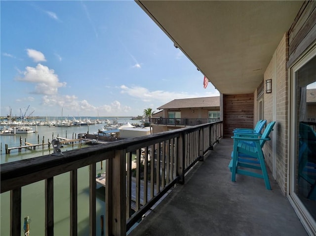 balcony featuring a water view