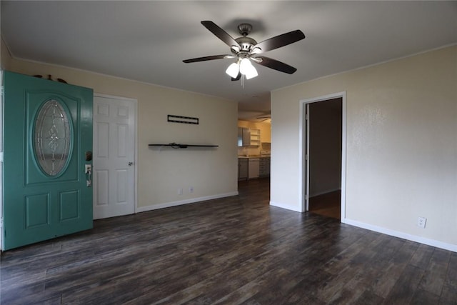 entryway featuring dark wood-style floors, a ceiling fan, and baseboards