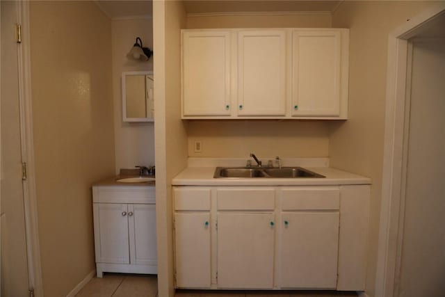 639 N Commercial St, Aransas Pass, TX 78336 - kitchen featuring white cabinetry, light countertops, and a sink