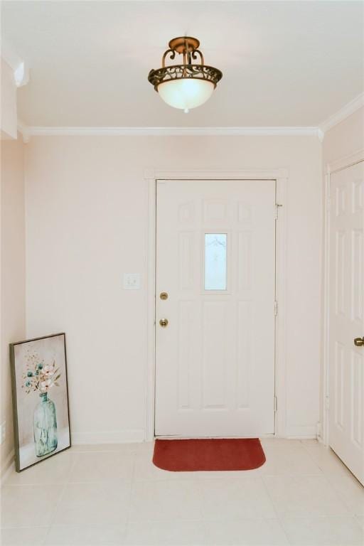 foyer with light tile patterned flooring, baseboards, and ornamental molding