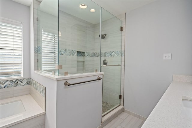 bathroom with vanity and an enclosed shower