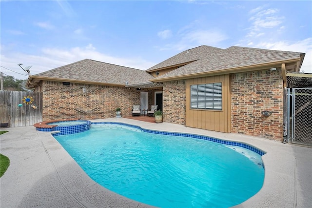 view of pool featuring an in ground hot tub and a patio area