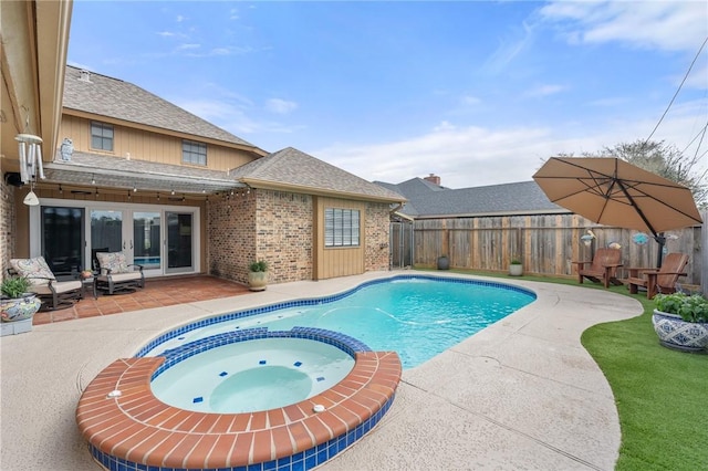 view of pool featuring a patio, french doors, and an in ground hot tub