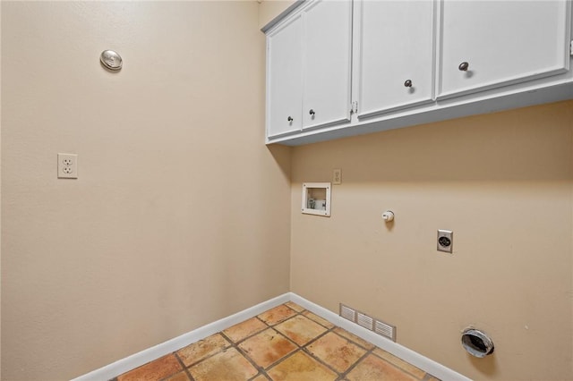 laundry area with light tile patterned floors, electric dryer hookup, hookup for a washing machine, cabinets, and hookup for a gas dryer