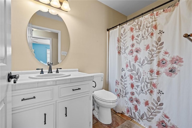 bathroom with vanity, tile patterned floors, and toilet