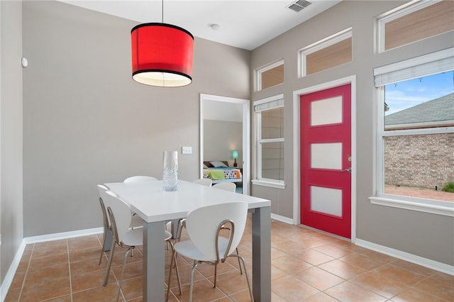 139 Heron Oaks St, Rockport, TX 78382 - dining room with light tile patterned flooring and baseboards