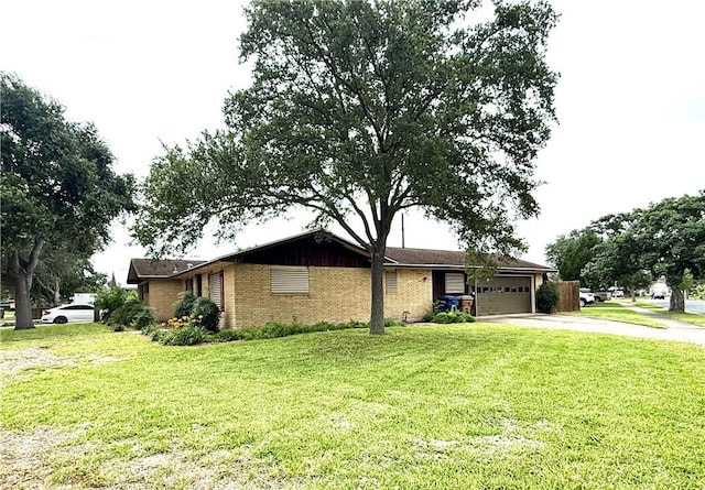 1601 Spicewood Dr, Corpus Christi, TX 78412 - view of front of home with a garage, driveway, a front yard, and brick siding