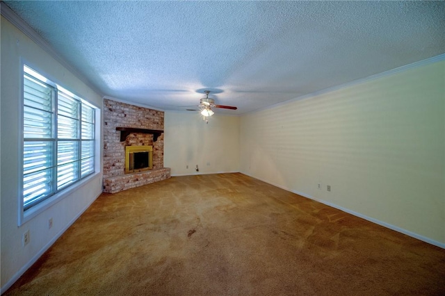 1601 Spicewood Dr, Corpus Christi, TX 78412 - unfurnished living room featuring carpet floors, a textured ceiling, ceiling fan, ornamental molding, and a fireplace