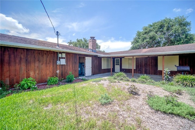 1601 Spicewood Dr, Corpus Christi, TX 78412 - back of house featuring a chimney