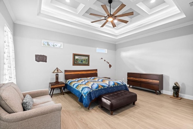 bedroom with visible vents, ornamental molding, light wood-style floors, a ceiling fan, and coffered ceiling